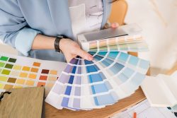 Close-up,Of,Architect,Woman,Choosing,Samples,Of,Wall,Paint.,Interior