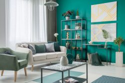 Bright,Sofa,With,Many,Pillows,Standing,Next,To,A,Green
