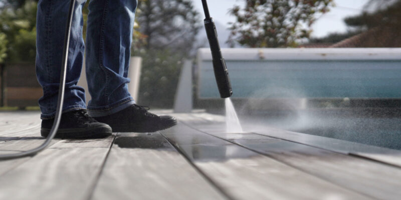 Man,Using,High,Pressure,Washer,Cleaning,Deck