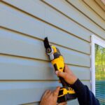 During,Reconstruction,Of,House,,Multi,Tools,Damaged,Vinyl,Siding,Is